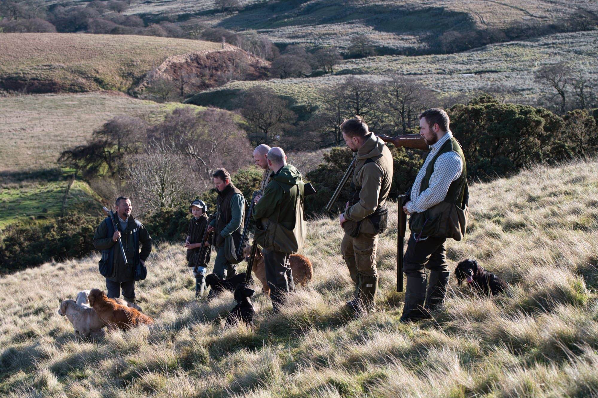 team of guns taking a break for a tough day on the moors 