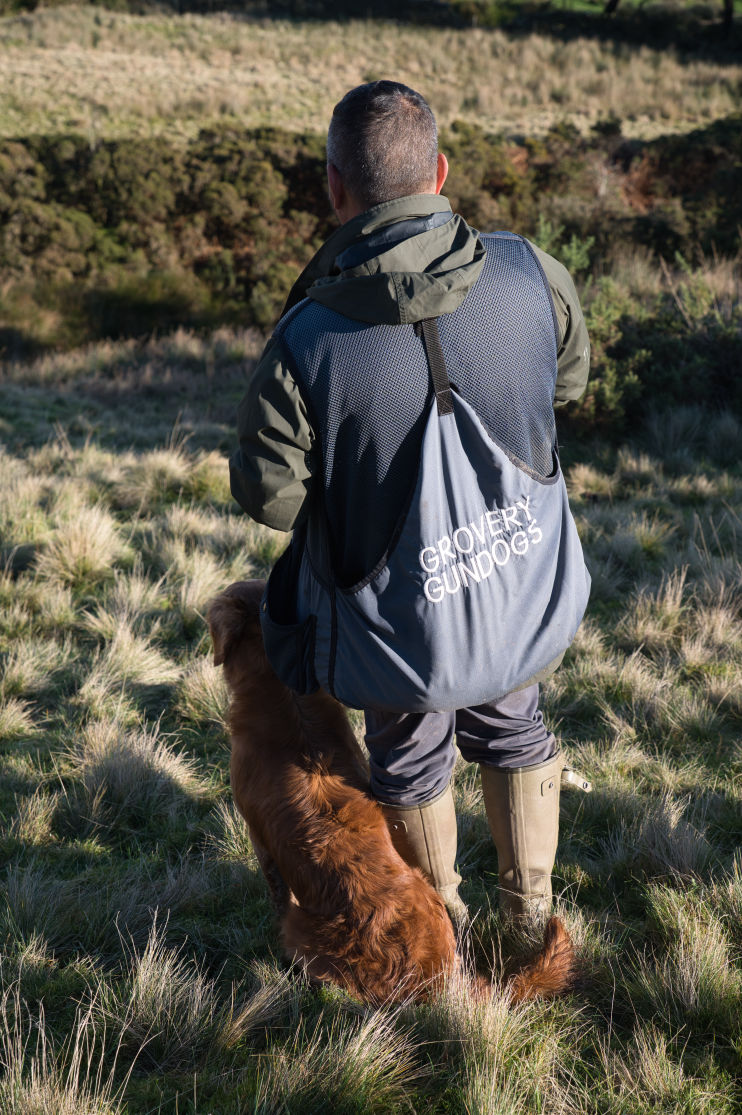 Shoot captain sending his dog for a really long retrieve.
